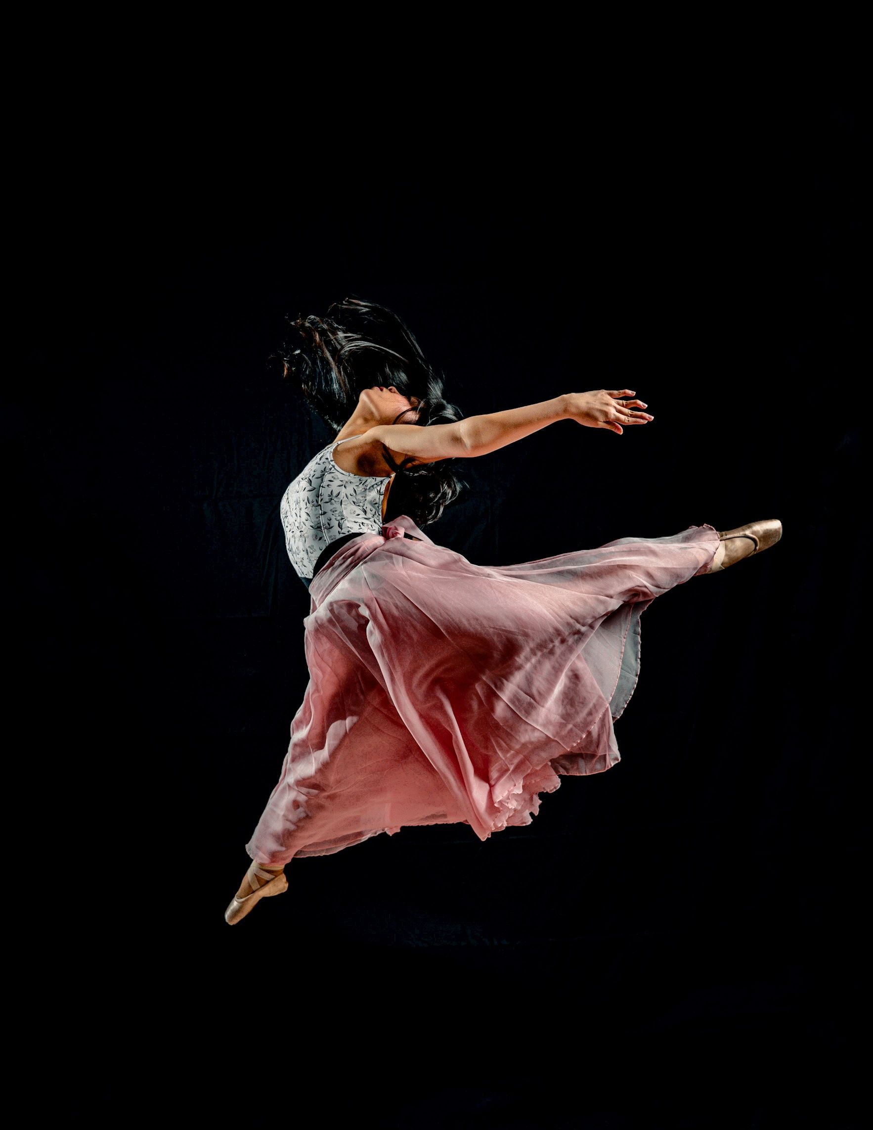 Graceful Ballet Dancer in Mid-Air Leap