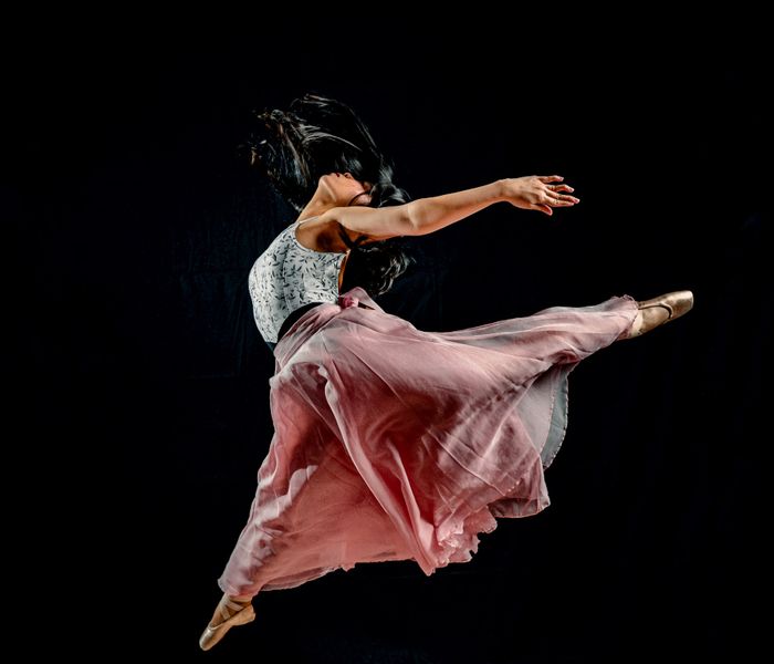 Graceful Ballet Dancer in Mid-Air Leap