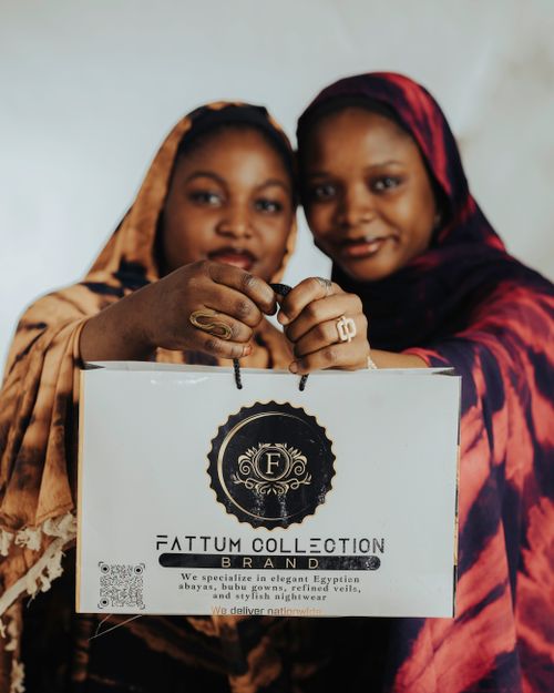 Free Two women showcasing Fattum Collection brand in stylish traditional attire. Stock Photo