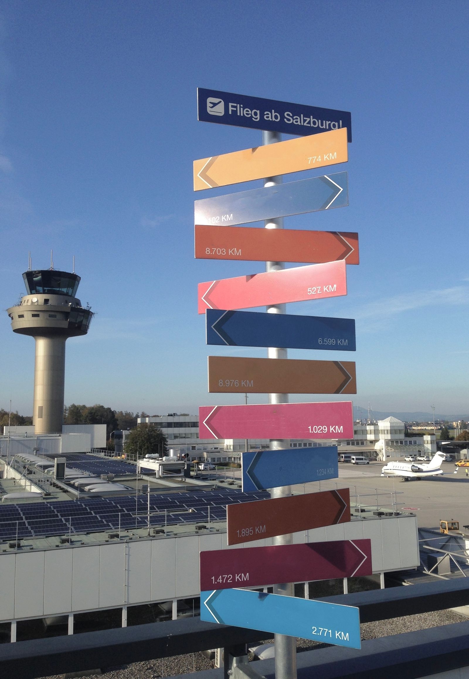 Airport signage directing travelers to check-in counters