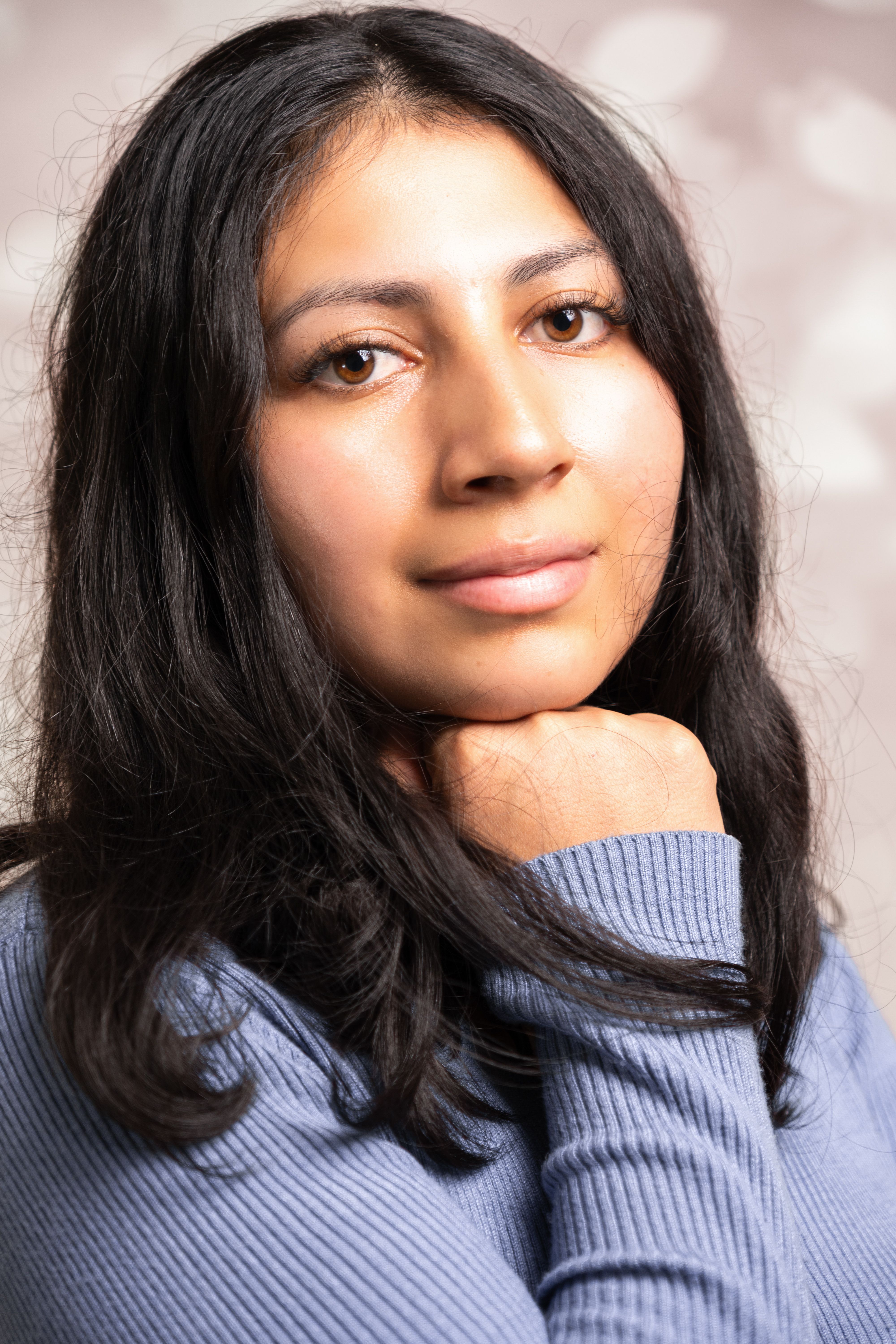 Portrait of a Woman with Long Hair and Blue Shirt · Free Stock Photo