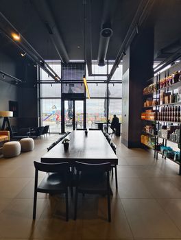 A stylish modern cafe with industrial interior design and cozy atmosphere.