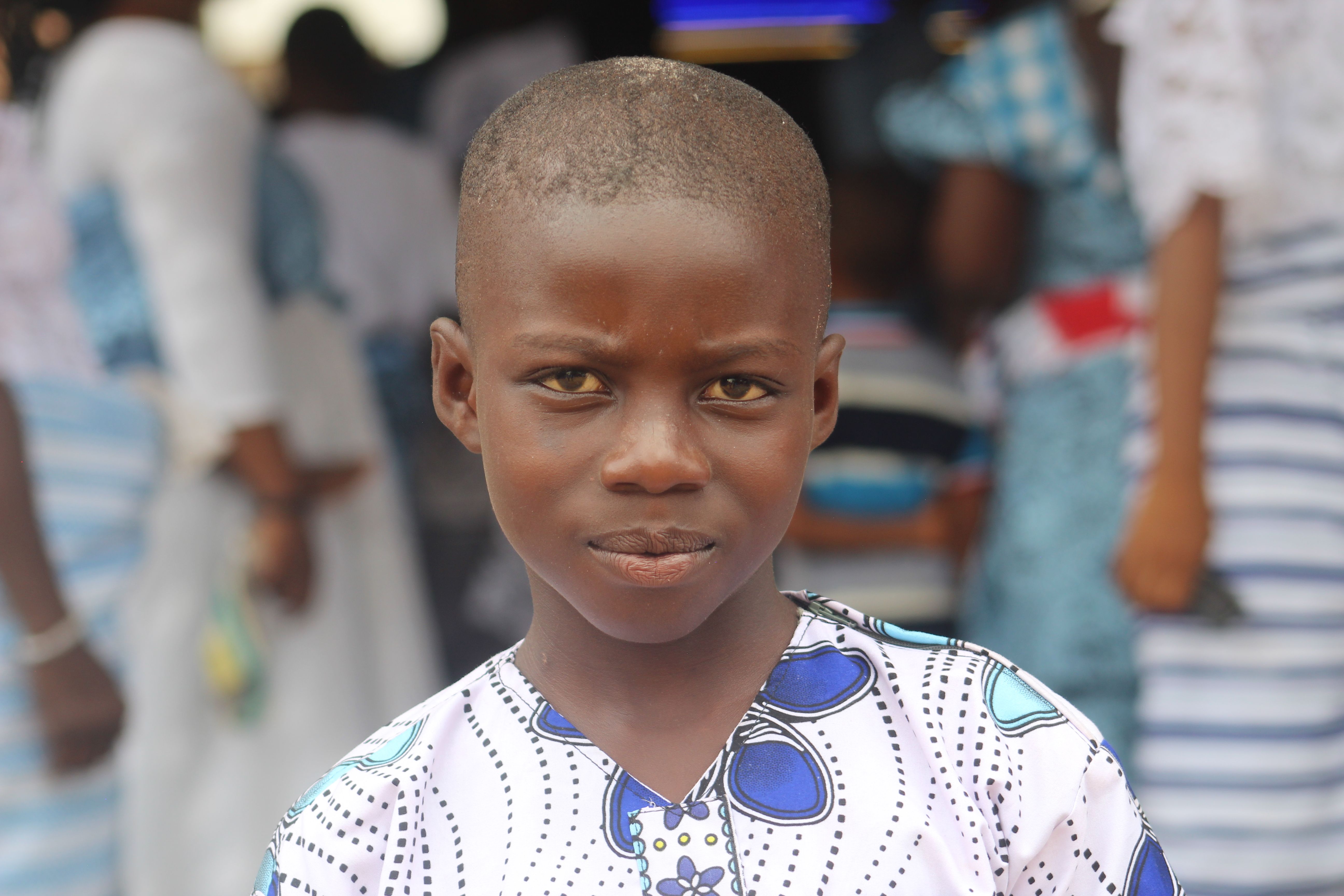 Portrait of a Young Boy in Traditional Attire · Free Stock Photo