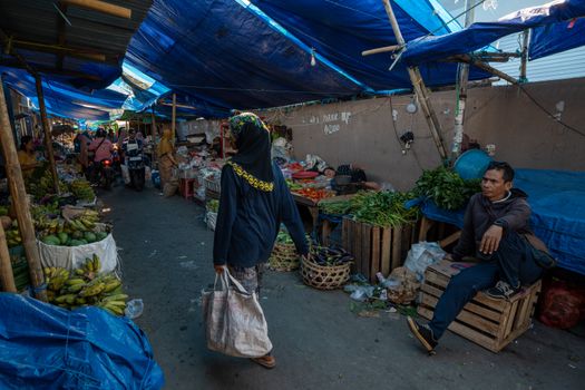 Capture of a bustling local market in West Nusa Tenggara, Indonesia, showcasing daily life.