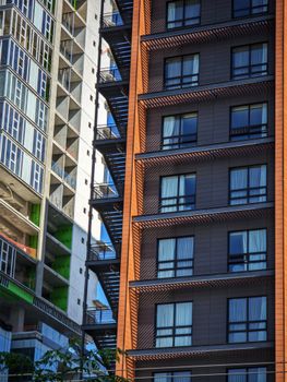 Close-up of contrasting modern apartment buildings with diverse architectural styles.
