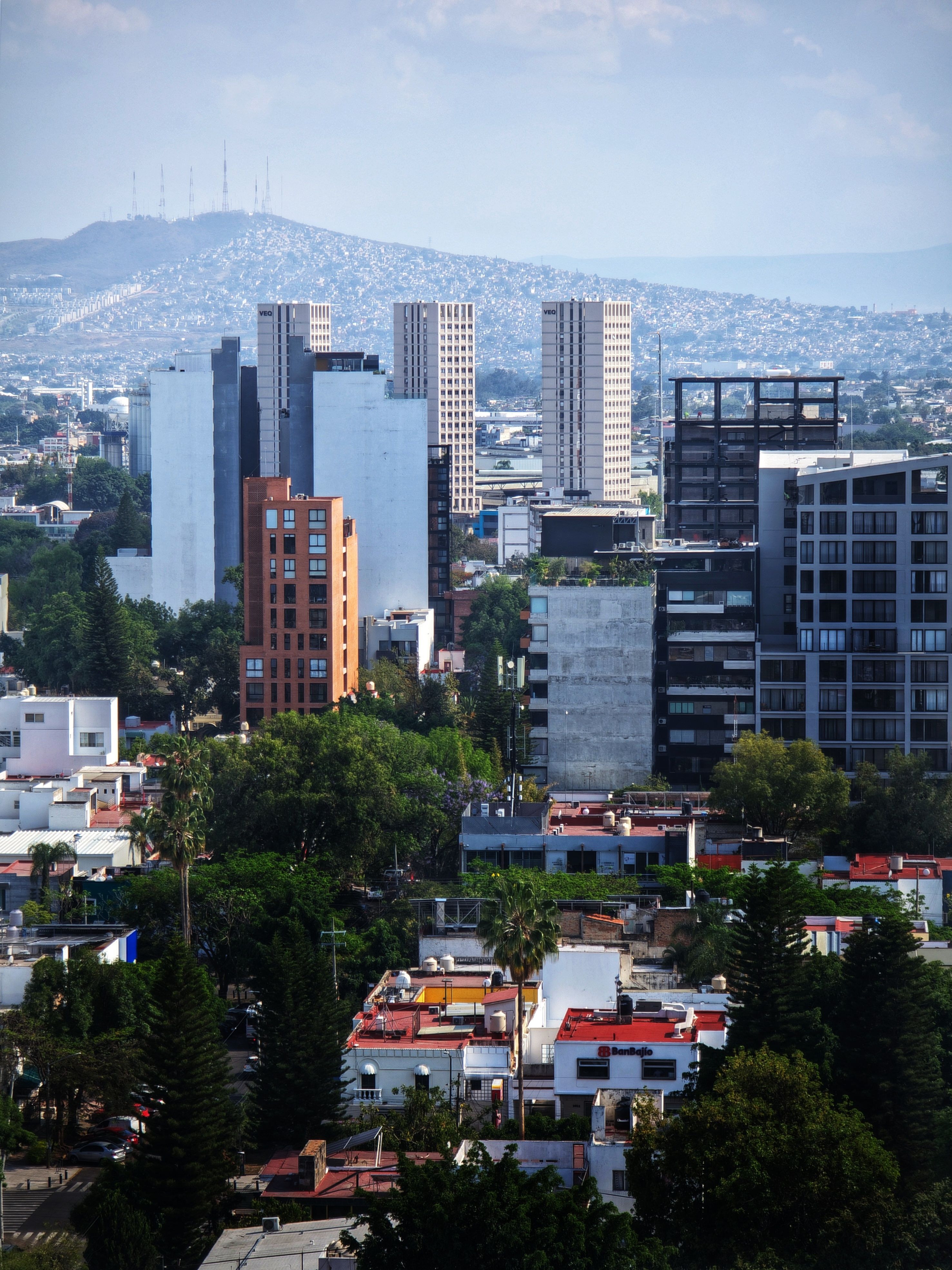 Urban Skyline with Mid-Rise Buildings and Mountain View · Free Stock Photo