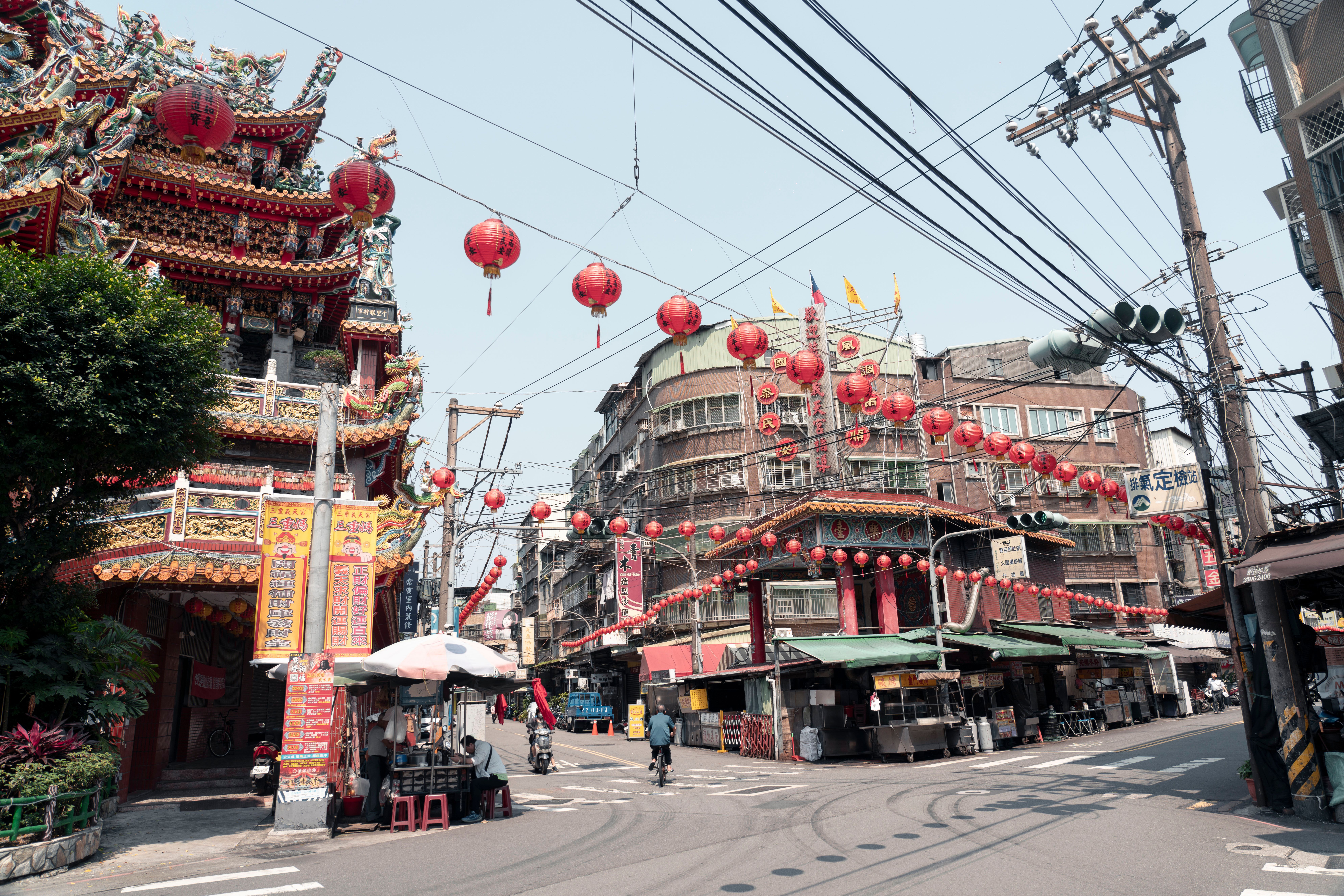 A Taipei street hung with red lanterns above shopfronts