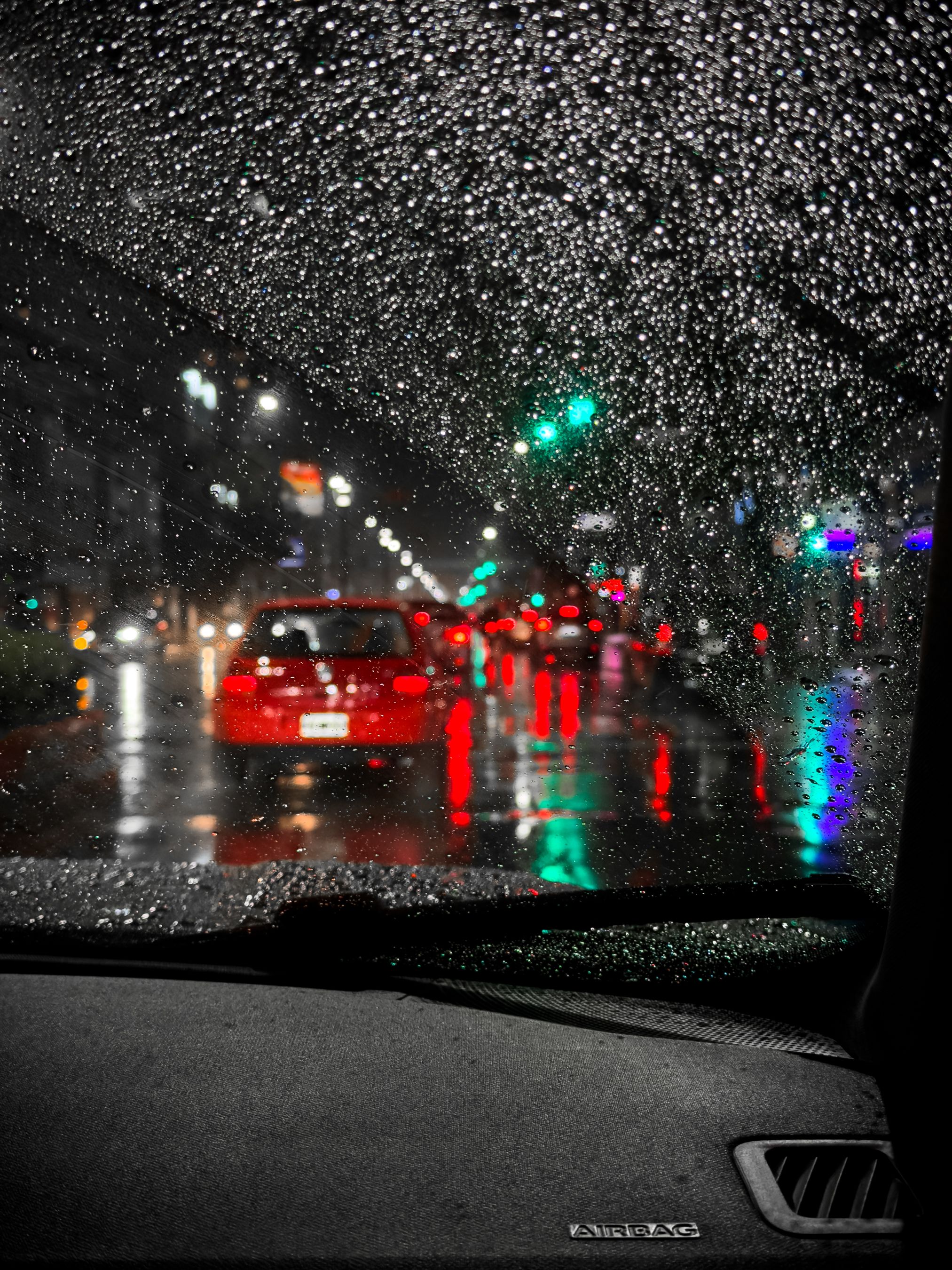 Rainy Night Traffic through Car Windshield · Free Stock Photo