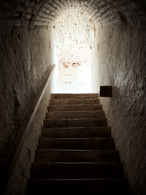 Free Ancient stone archway staircase leading to daylight in Alta Gracia, Argentina. Stock Photo