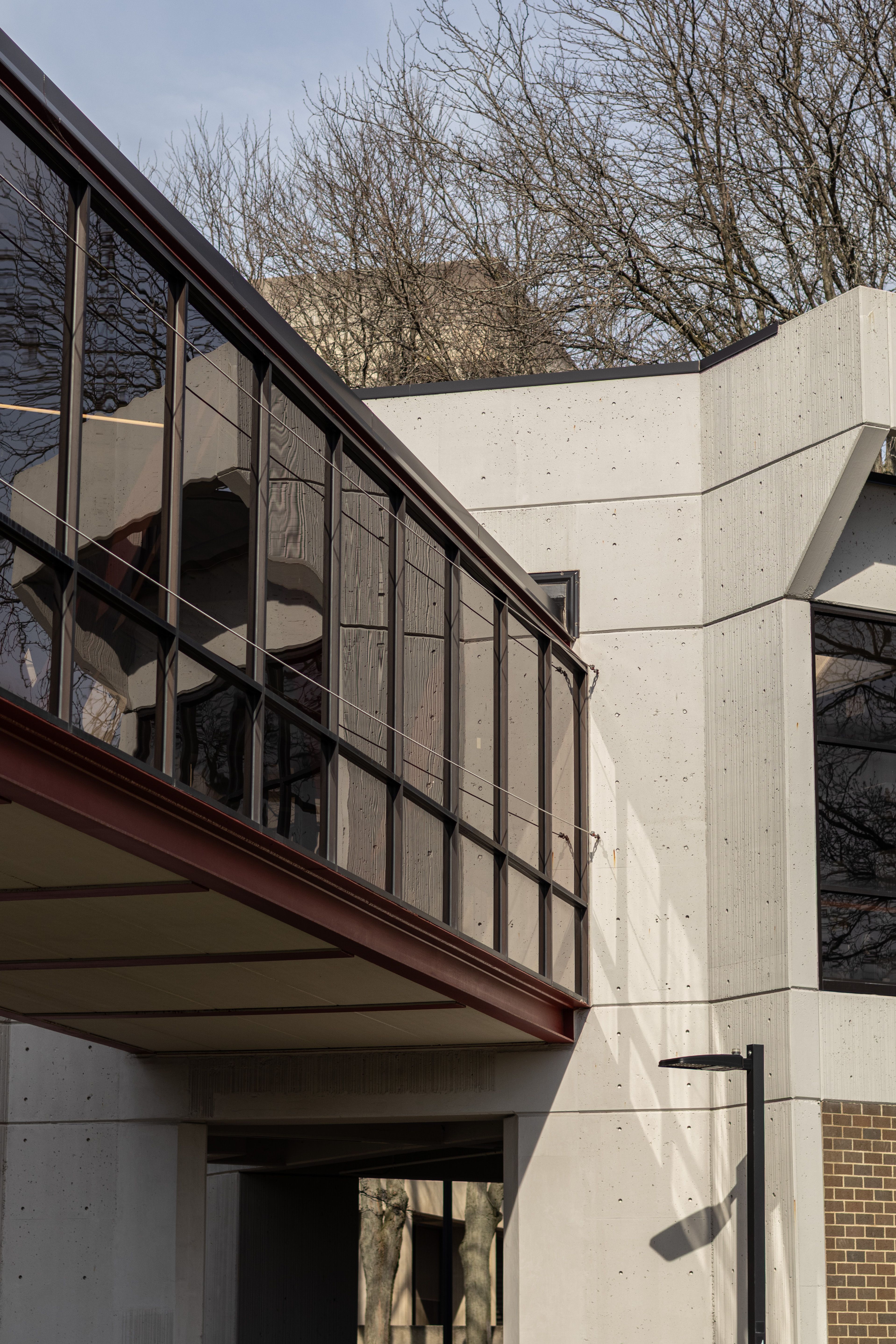 Modern Architectural Design with Glass Walkway · Free Stock Photo