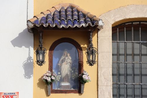 Free A niche with the Virgen del Carmen statue on a colorful wall in El Puerto de Santa María, Spain. Stock Photo