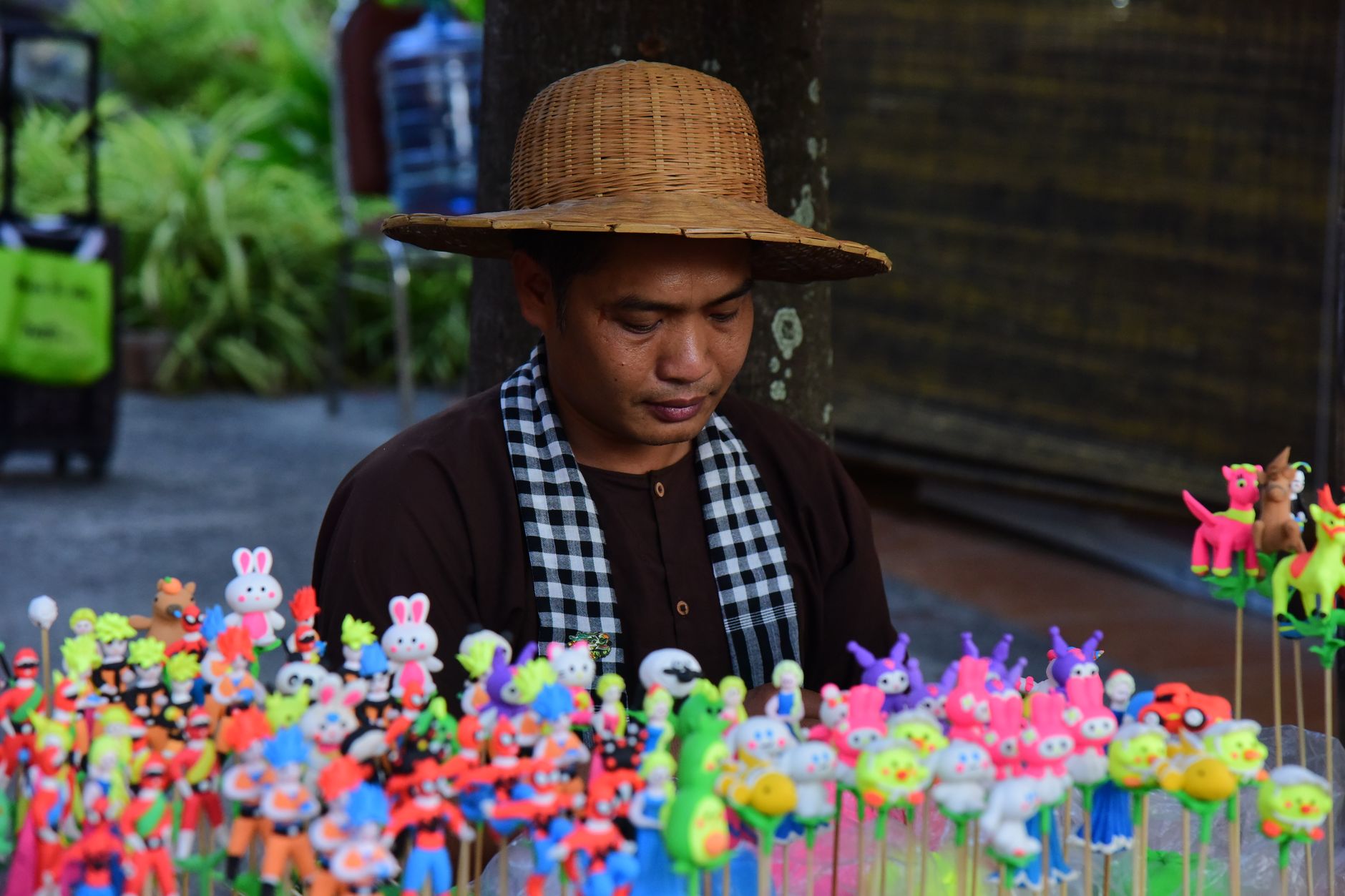 Crowded tourist stall selling souvenirs on a Bangkok street