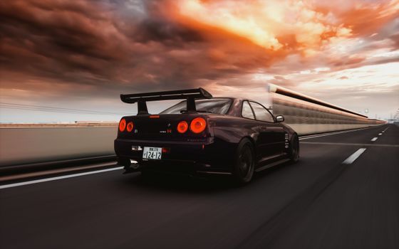 A Nissan R34 Skyline speeds down a highway in Pippu, Hokkaido under a dramatic sunset sky.
