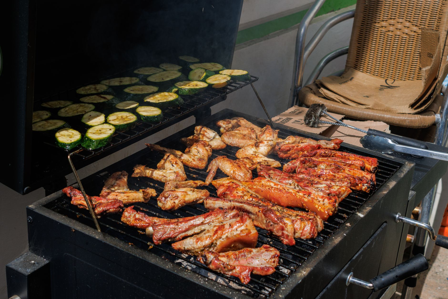 Grilled zucchini and squash served on platter with herbs