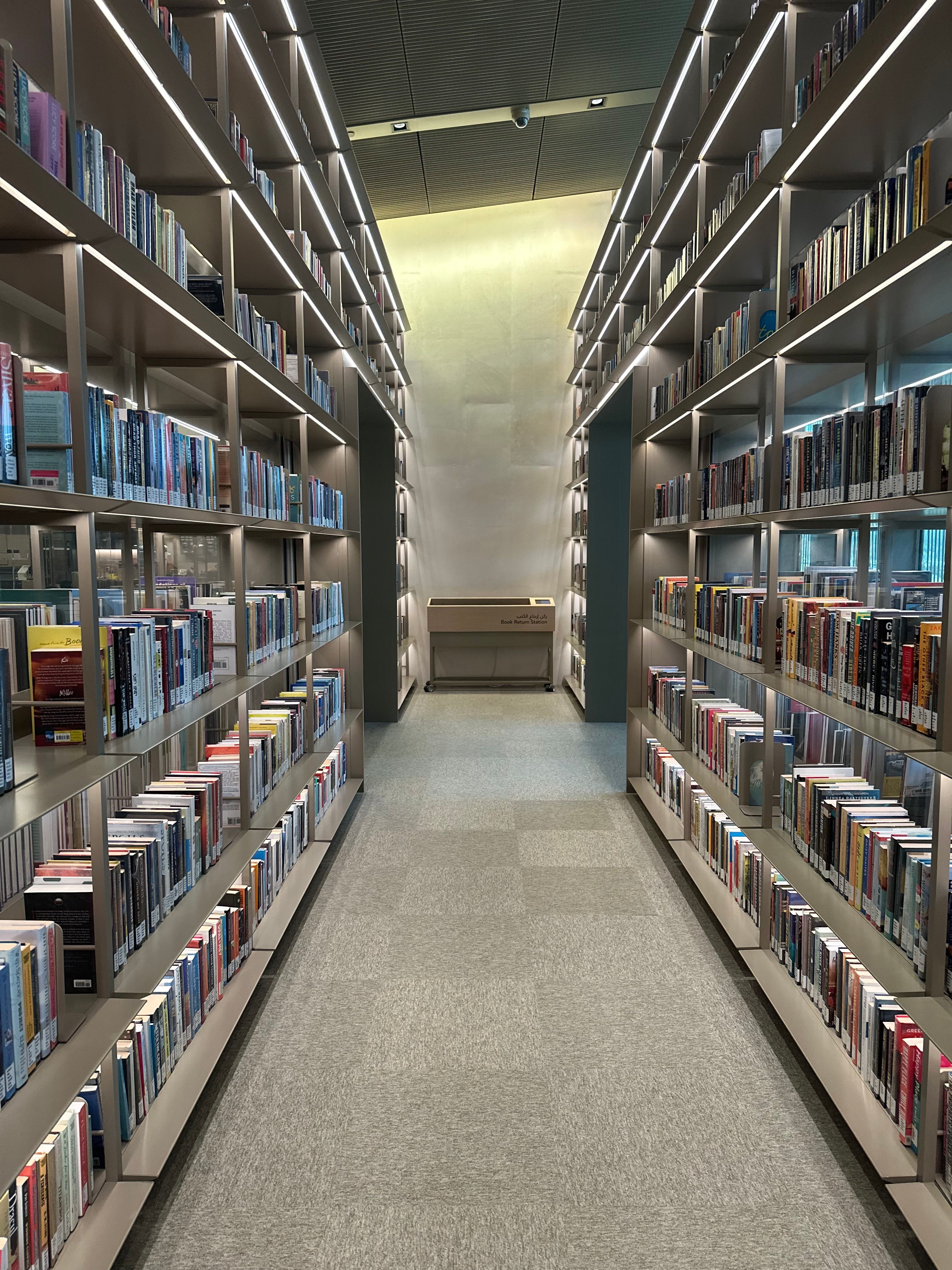 Modern Library Aisle with Bookshelves · Free Stock Photo