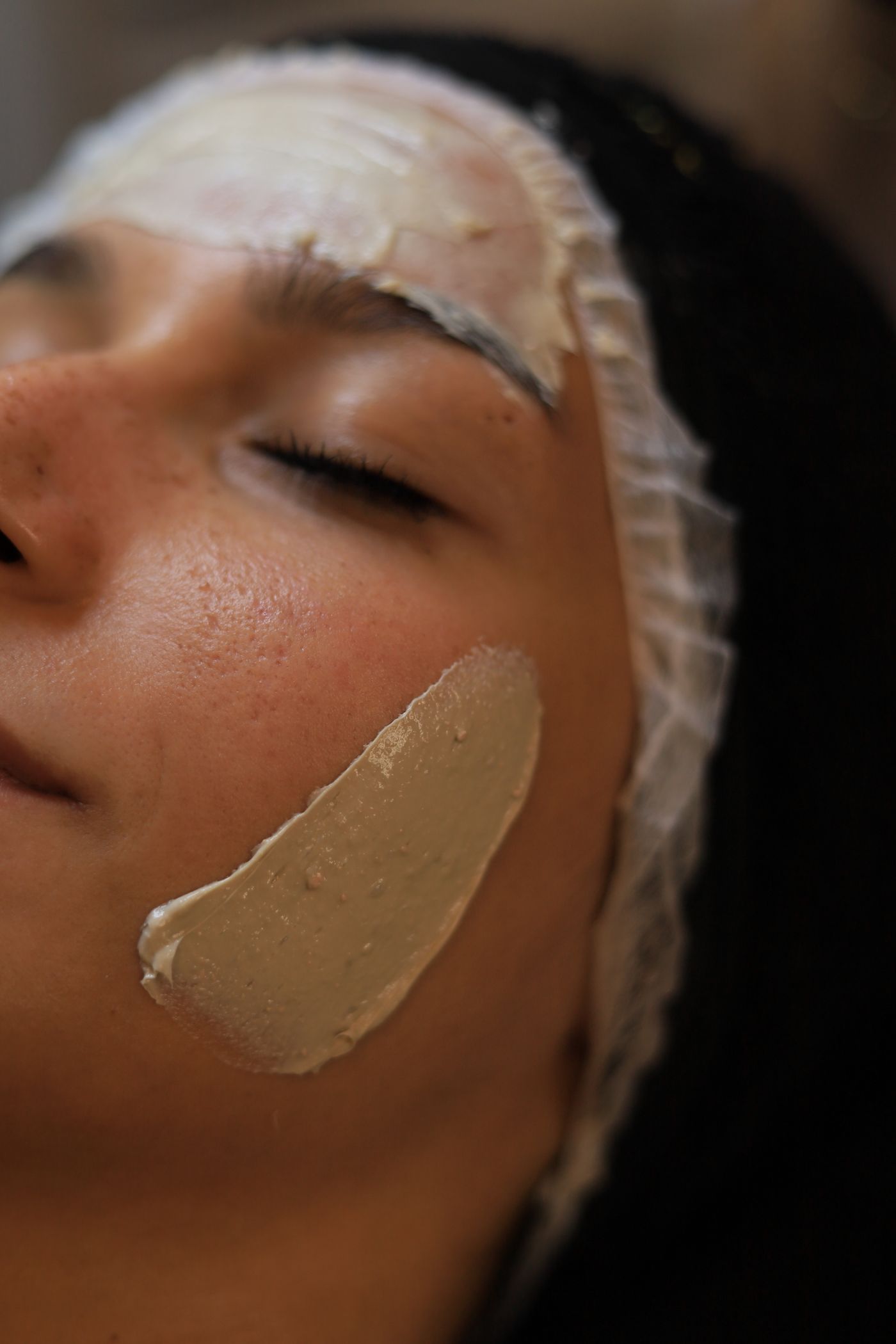 Relaxing professional facial treatment with clay mask