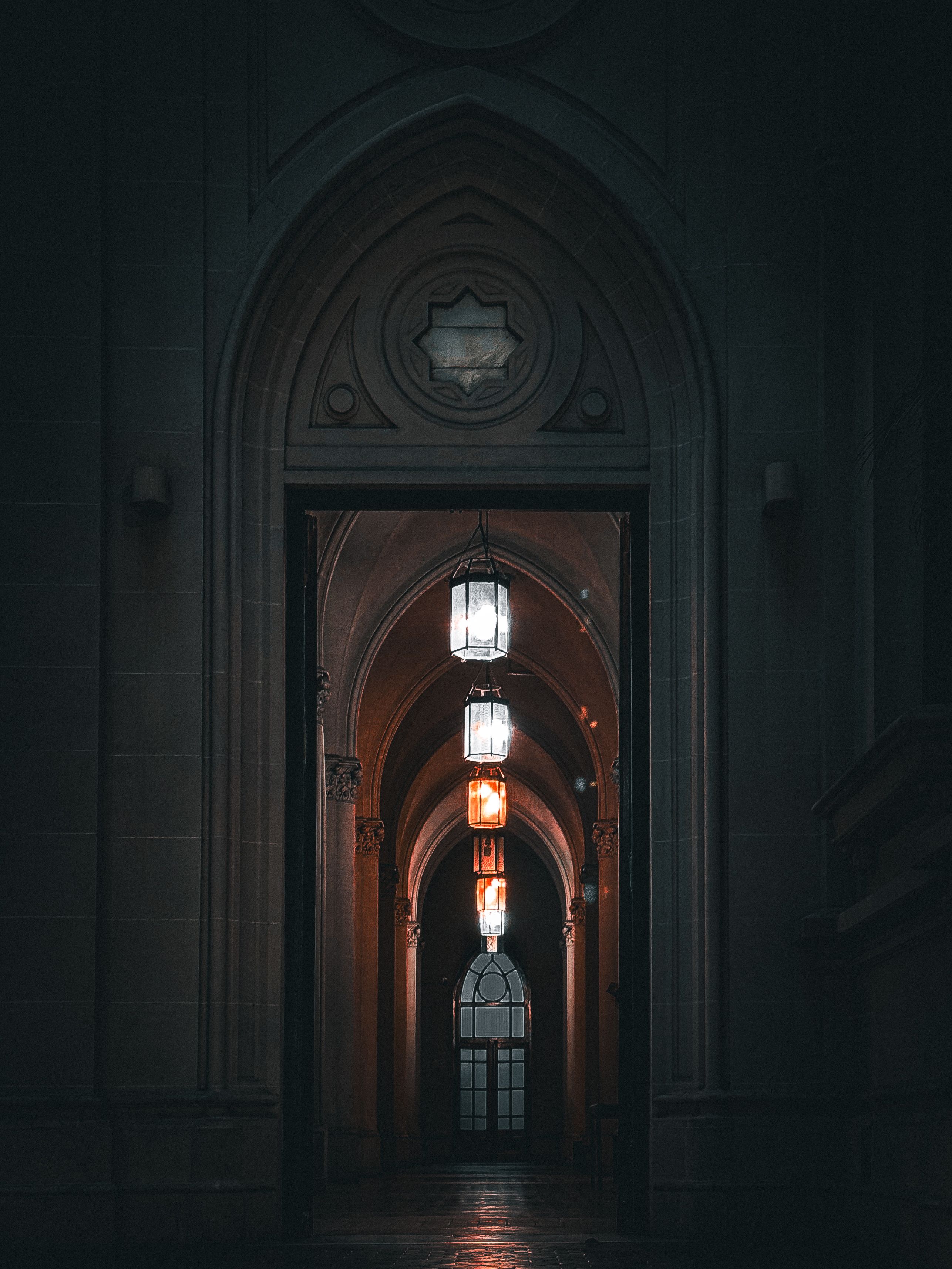 Gothic Arched Hallway with Hanging Lights · Free Stock Photo