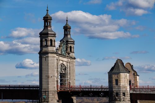 Free Historic Brandenburg Gate in Sovetsk, Russia against a bright blue sky. Stock Photo