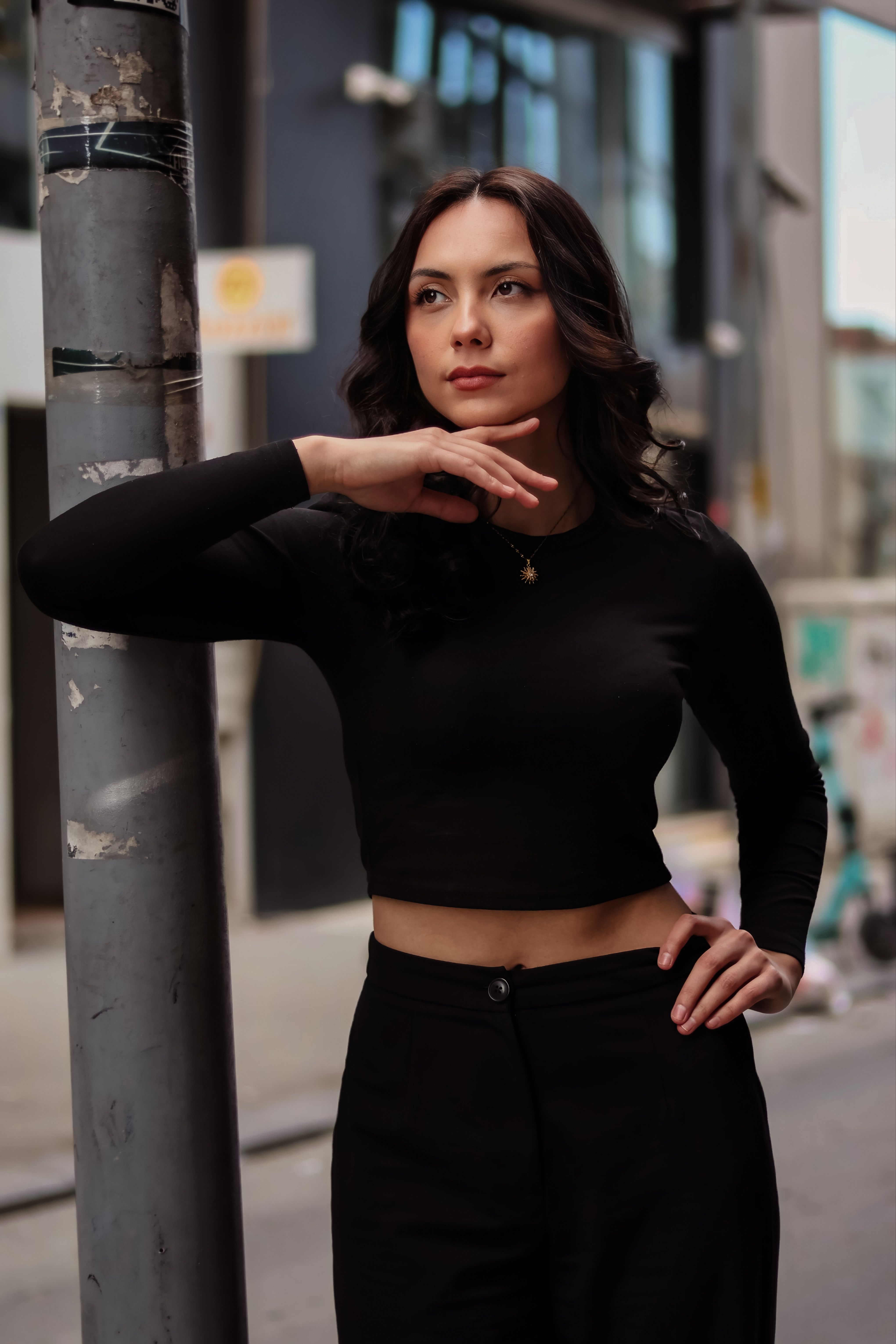 Stylish Woman Posing in Urban Street Setting · Free Stock Photo