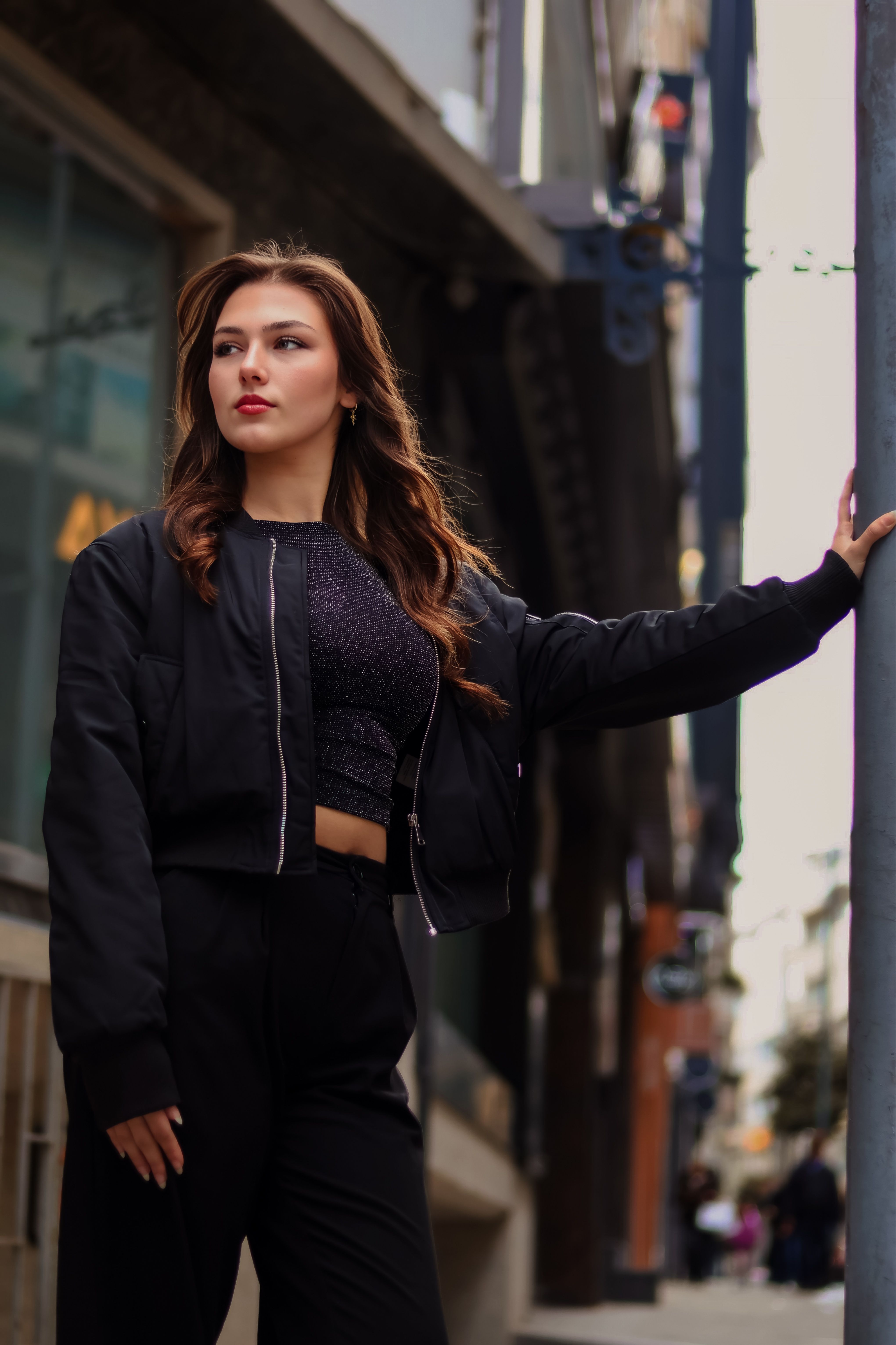 Stylish Woman Posing in Urban Street Setting · Free Stock Photo