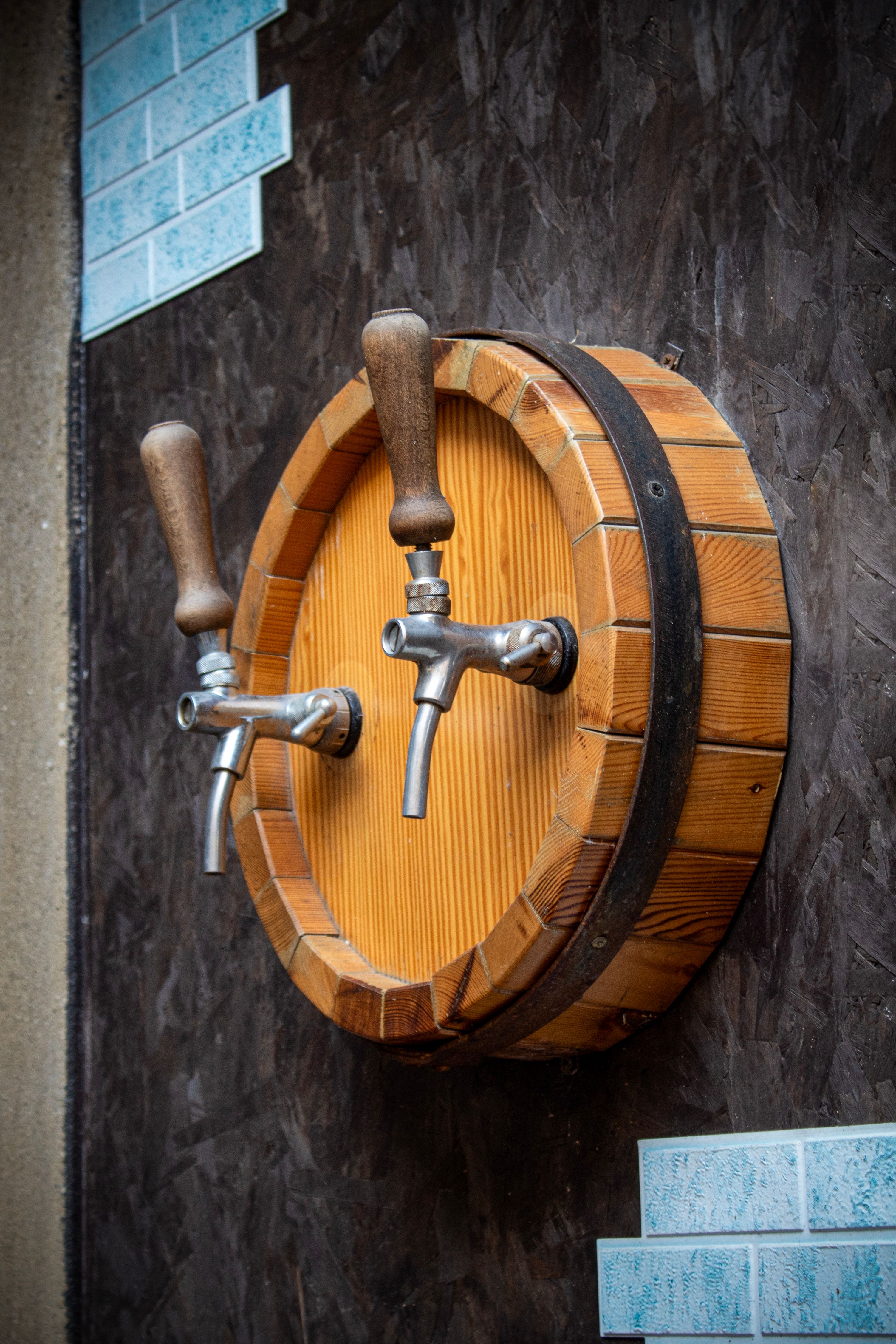 Rustic Wall-Mounted Wooden Barrel Taps · Free Stock Photo