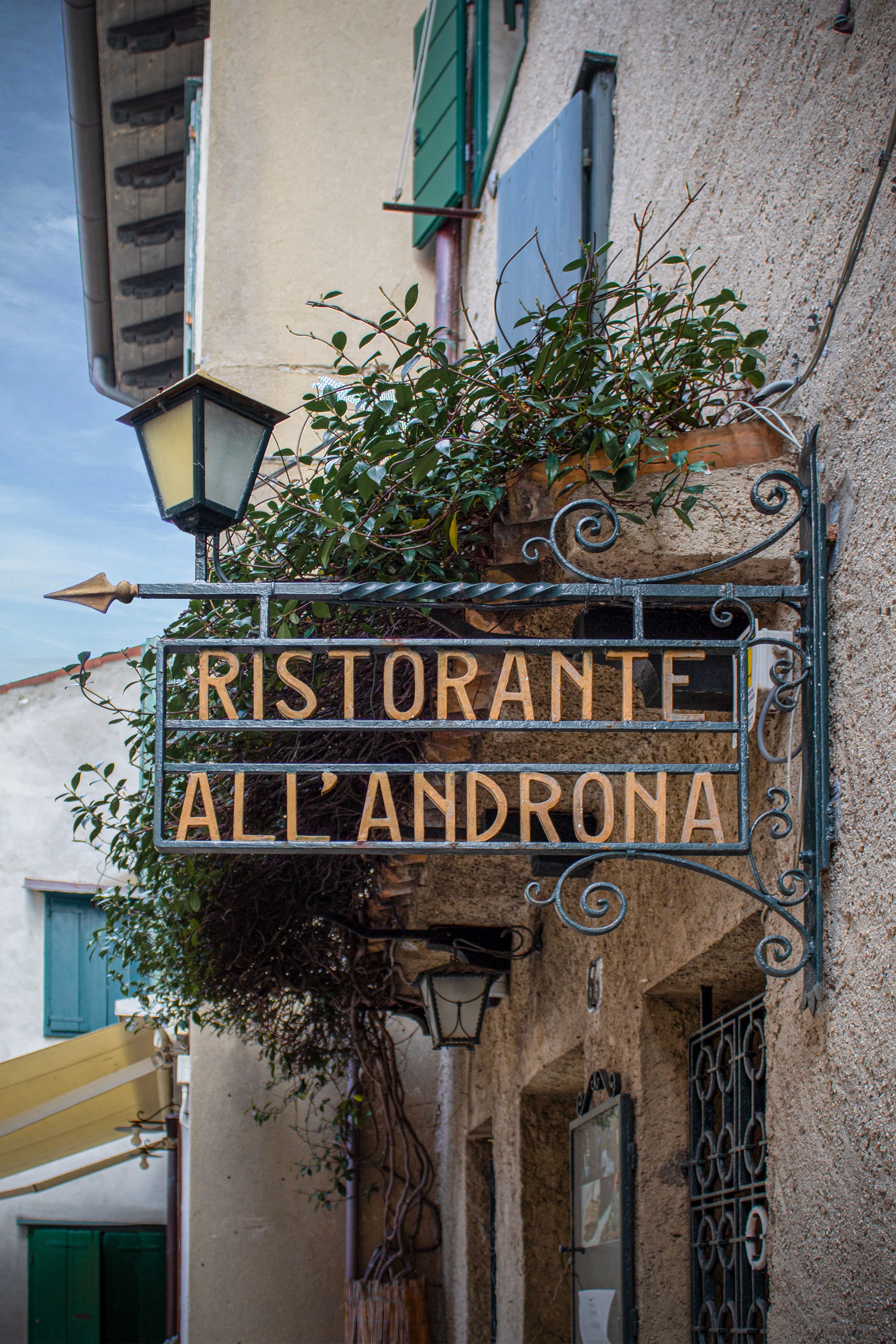 Vintage restaurant sign 'Ristorante All'Androna' in Grado, Italy.