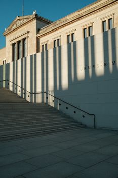 Elegant shadows cast on the steps of the James Simon Gallery, Berlin, Germany.