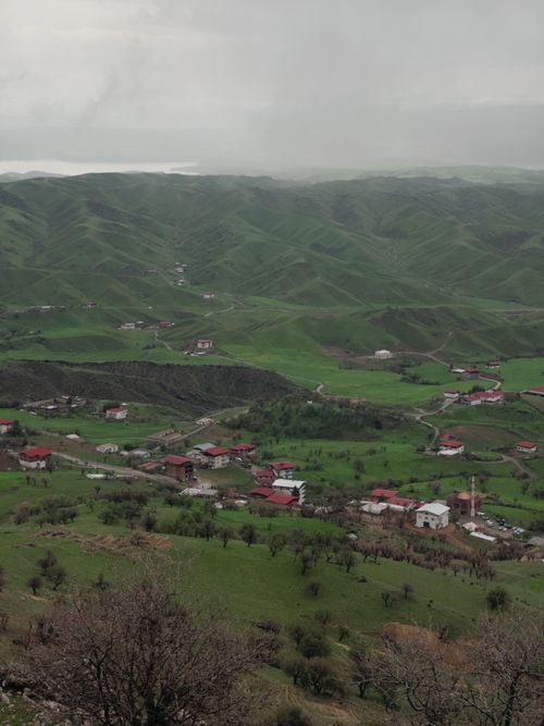 Free Lush green landscape of Kayar village with red-roofed buildings in spring. Stock Photo