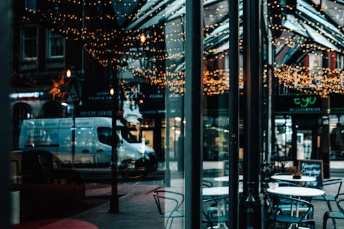 White Car Parked Near Glass Window