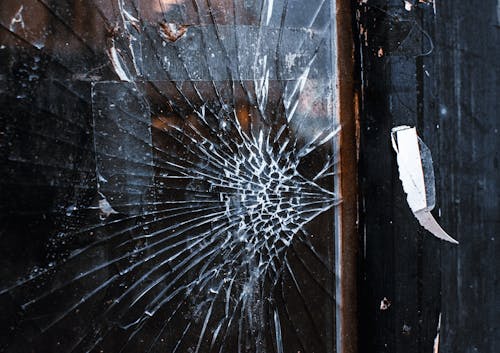 Broken Glass on Wooden Surface