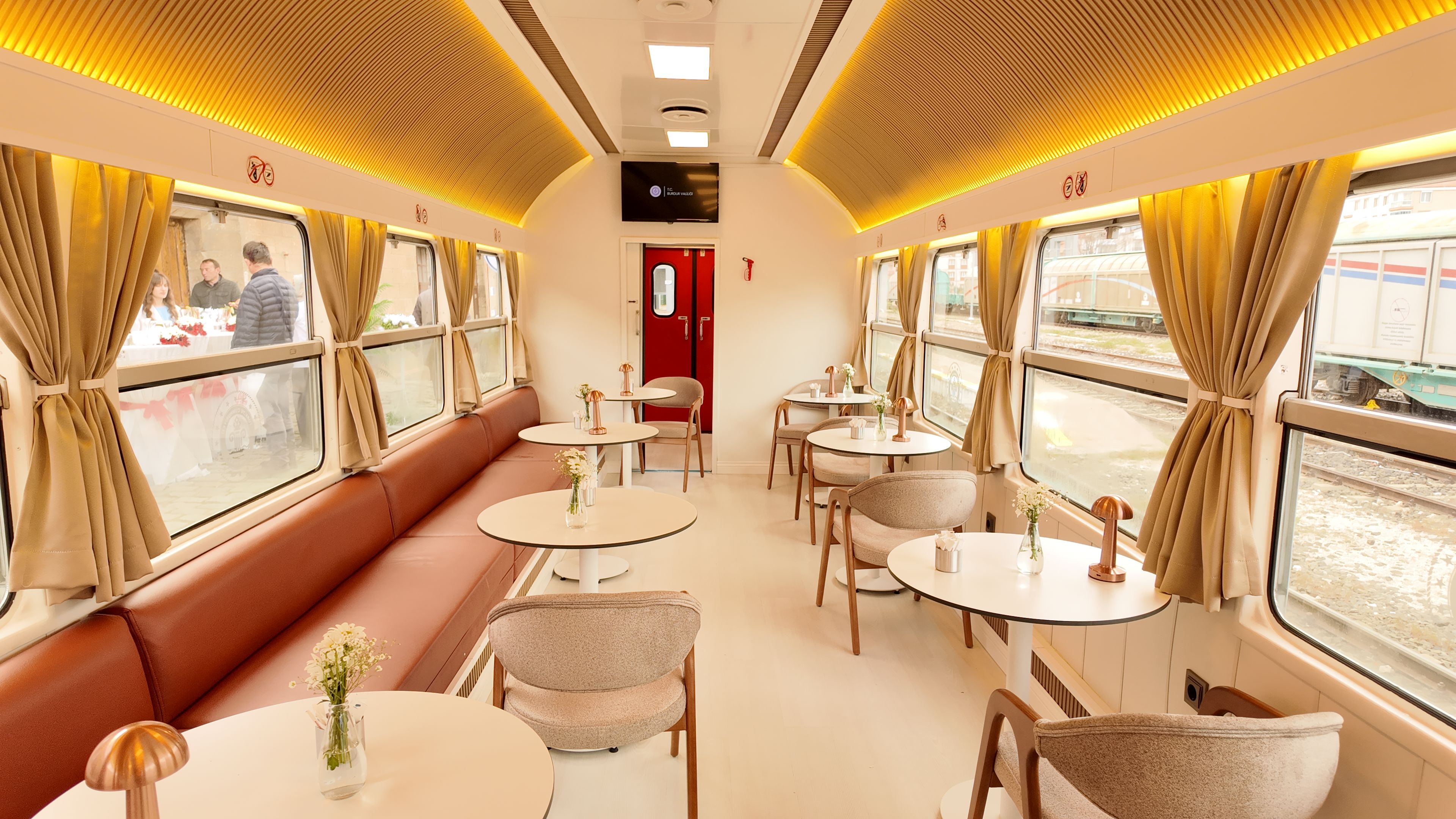 Warmly lit vintage dining car ideal for romantic rail travel