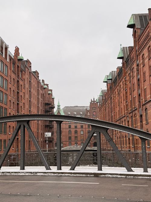 Free A view of the iconic red brick warehouses and bridges in Hamburg's UNESCO-listed Speicherstadt. Stock Photo