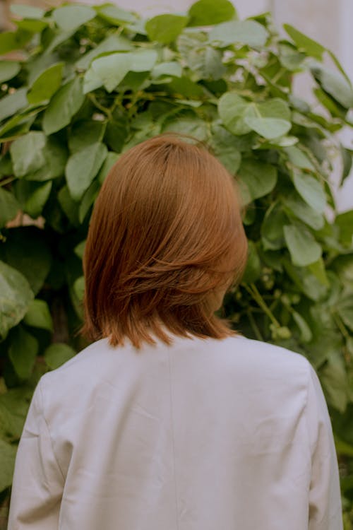Back View of Woman on Plant Background