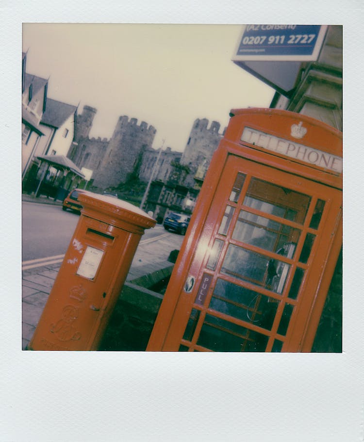 Vintage Red Telephone Booth On Street