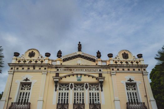 Front view of the historic Alberto Maranhão Theatre in Natal, Brazil, showcasing neoclassical architecture under a blue sky.