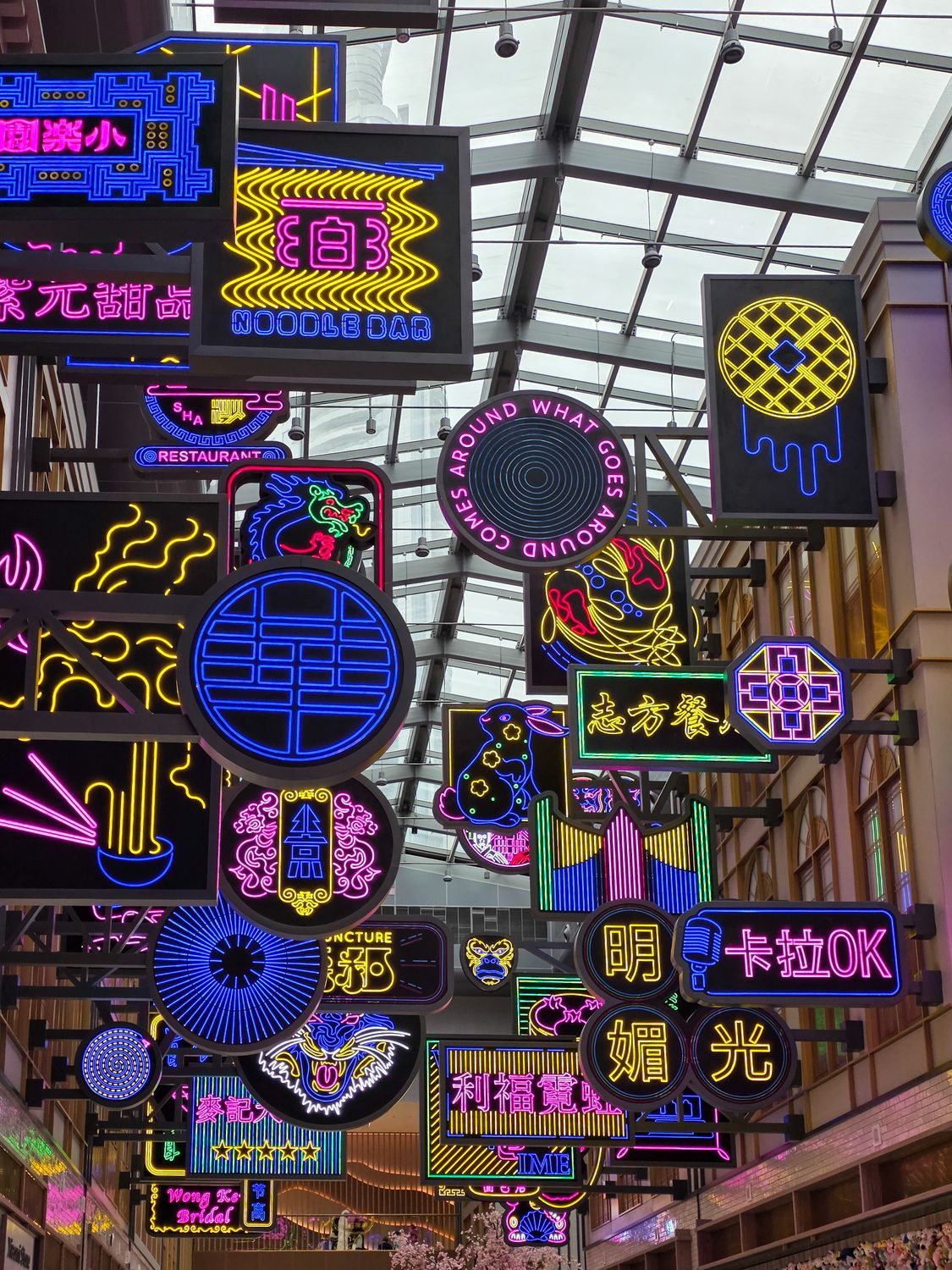 Colorful Neon Signs in Shopping Mall Interior · Free Stock Photo