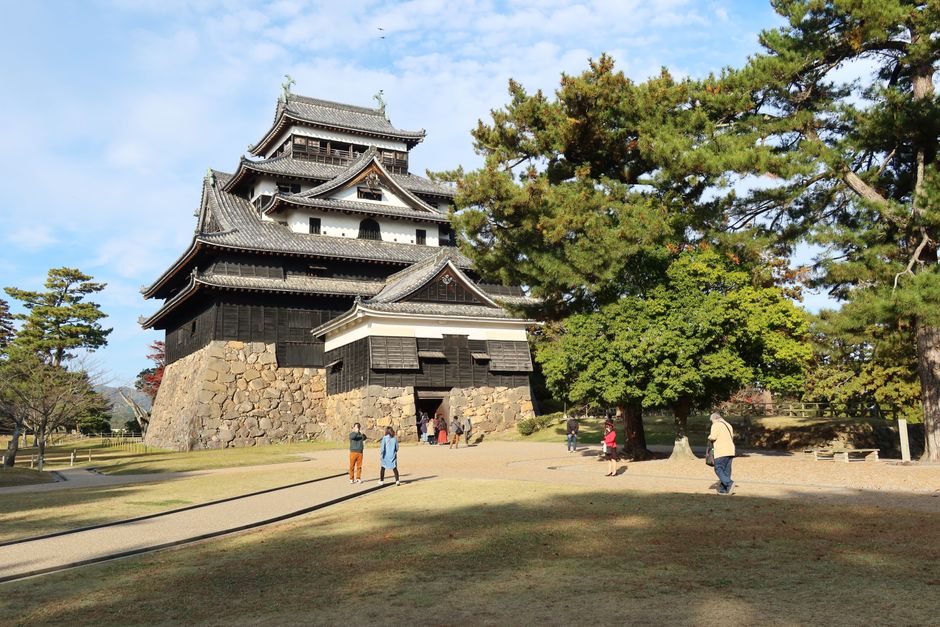 Stunning view of Matsue Castle amidst lush greenery in Matsue, Japan. A must-visit historical site.