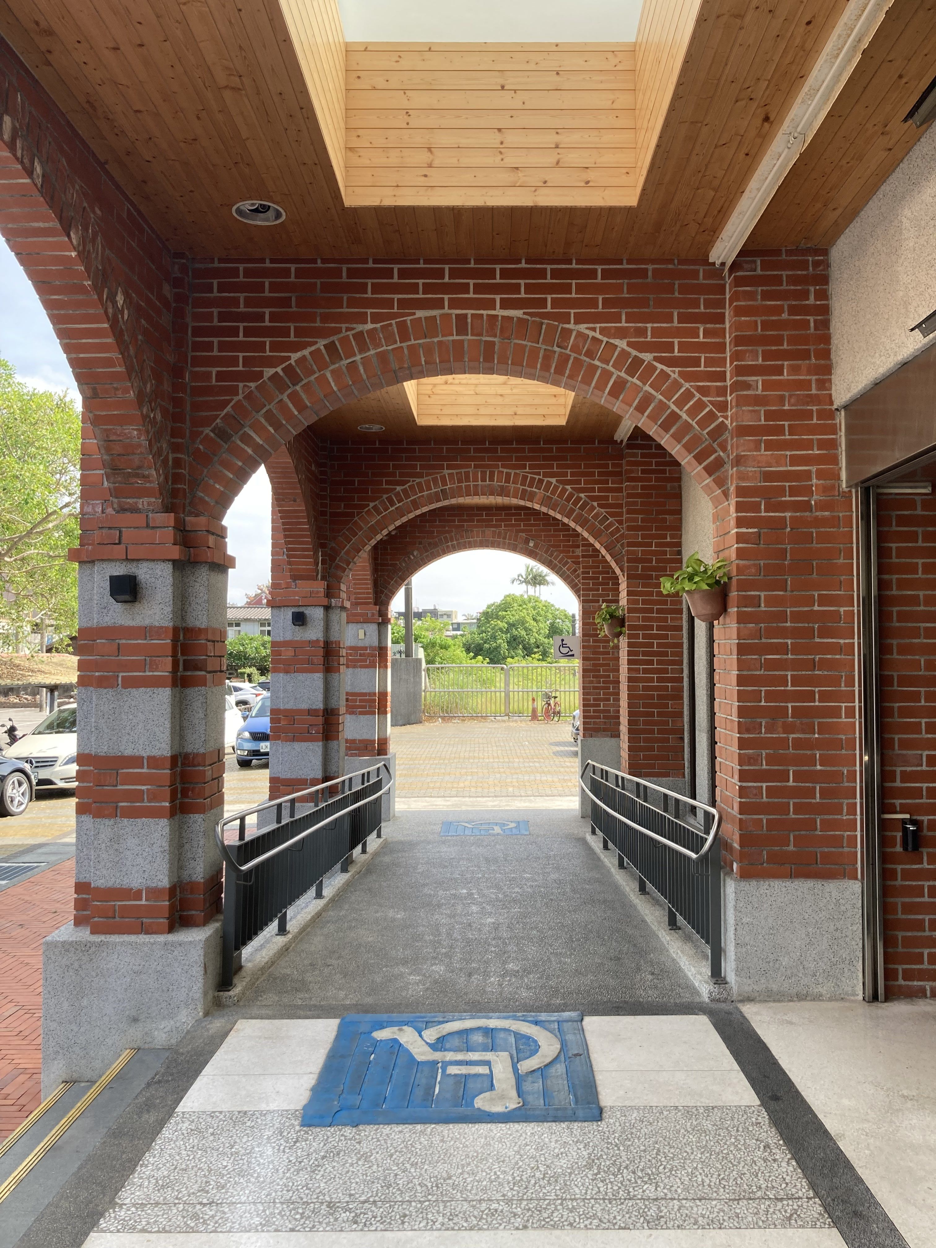 Accessible ramp at a brick building entrance