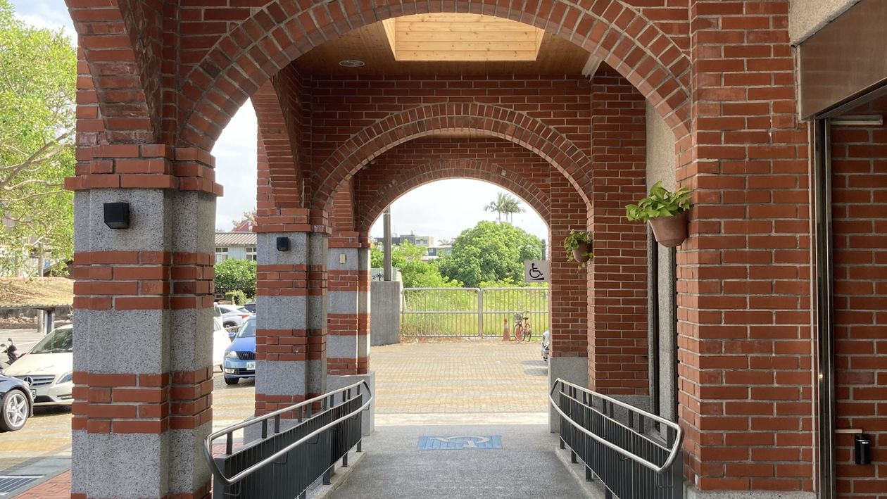 Accessible ramp at a brick building entrance