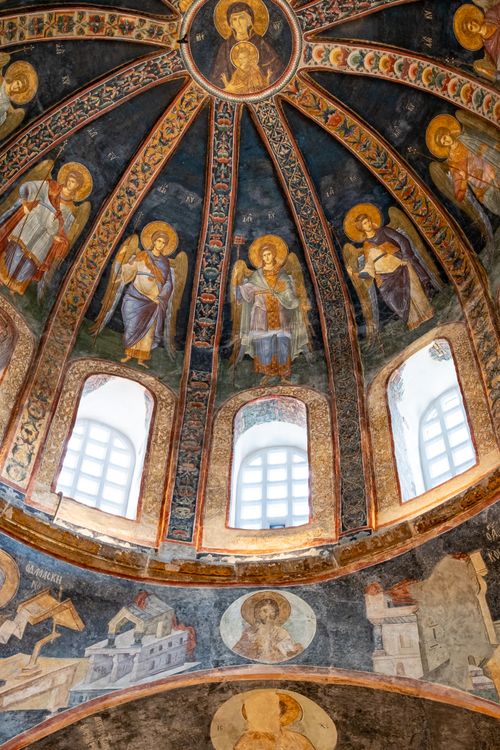 Free Intricately painted Byzantine dome featuring religious frescoes and archangels. Stock Photo