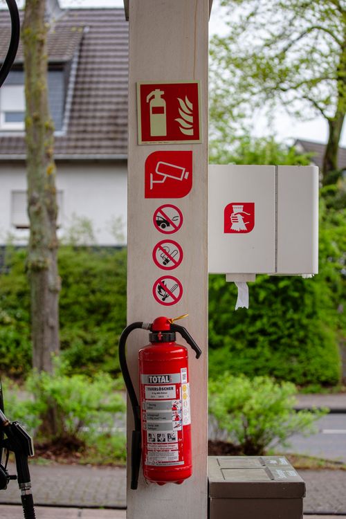 Free A fire safety station with instructions and extinguisher at a gas station in Bergisch Gladbach, Germany. Stock Photo