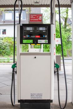 Close-up of a gas pump at a station in Bergisch Gladbach, Germany, featuring different fuel options.
