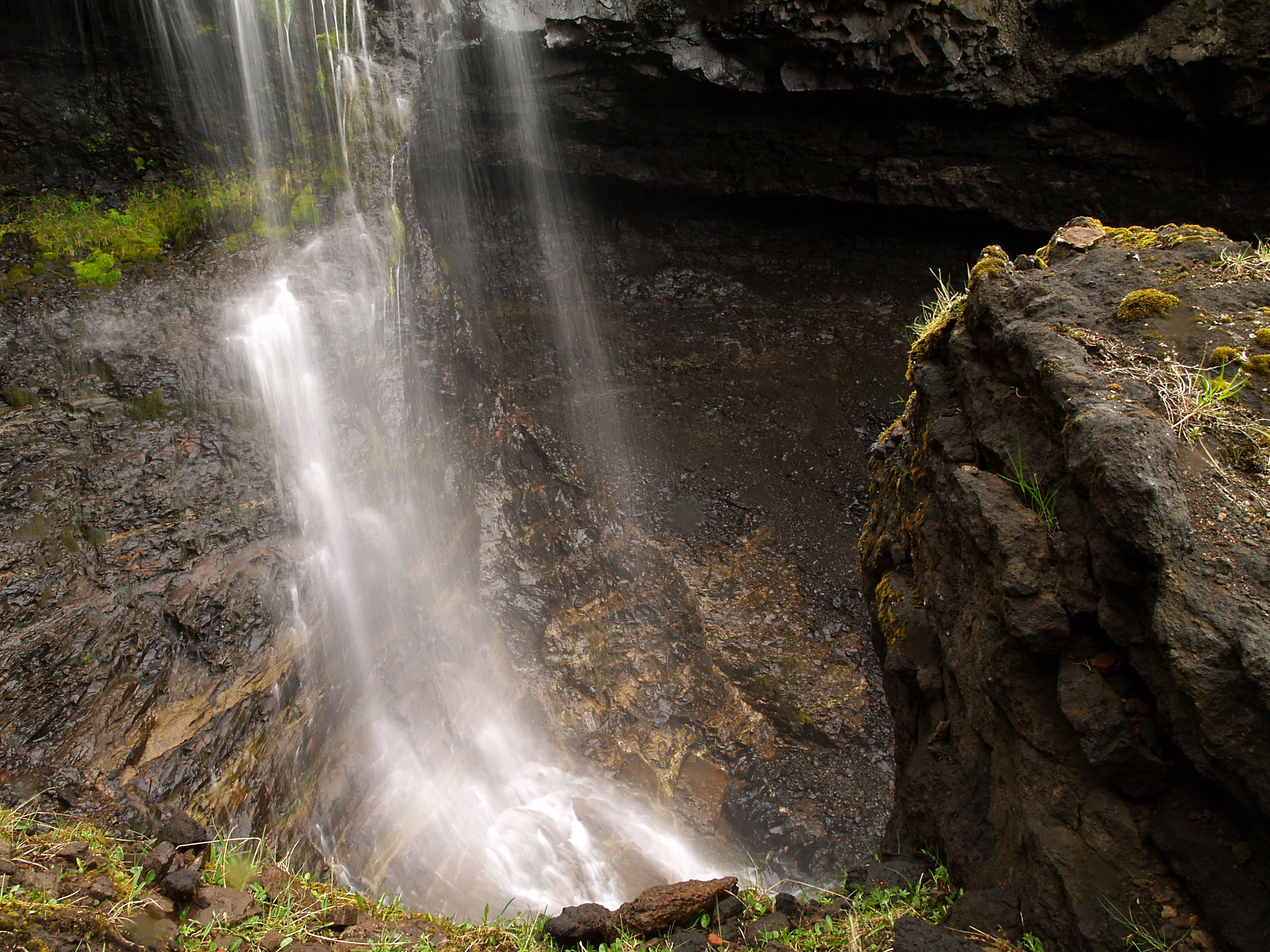 Stunning Waterfall Cascading Over Rocky Cliff · Free Stock Photo
