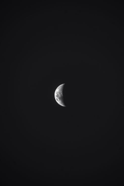 Free Detailed black and white photo of a crescent moon against a dark sky from Beheira, Egypt. Stock Photo