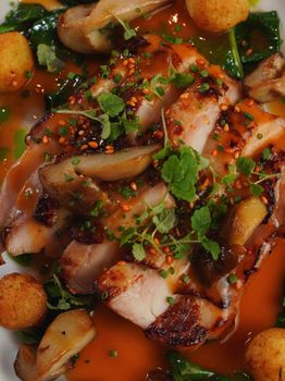 Delicious grilled chicken breast served with sautéed mushrooms, herbs, and a rich sauce.