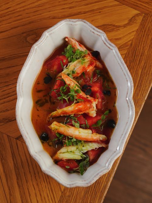 Free Elegant dish featuring crab and watermelon, garnished with herbs in a white bowl. Stock Photo