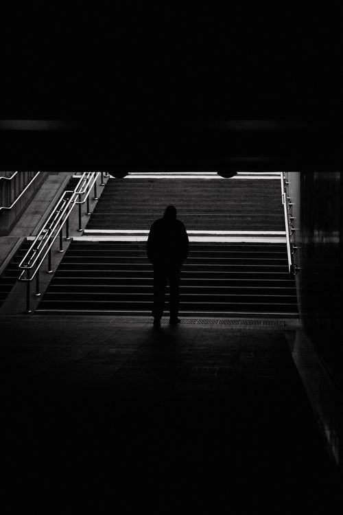 Free Dramatic silhouette of a person in a subway tunnel entrance, Minsk. Stock Photo