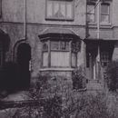 Grayscale Photo of An Abandoned Concrete House