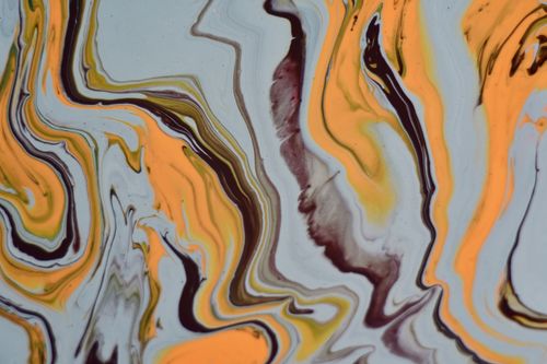 Free A captivating abstract artwork featuring vibrant swirls of yellow, orange, and brown hues. Stock Photo