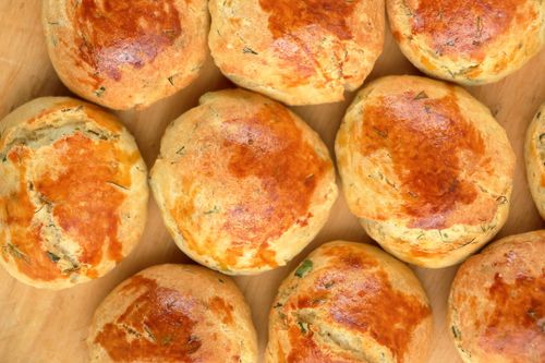 Free Golden brown herb bread rolls freshly baked on a wooden surface, top view. Stock Photo